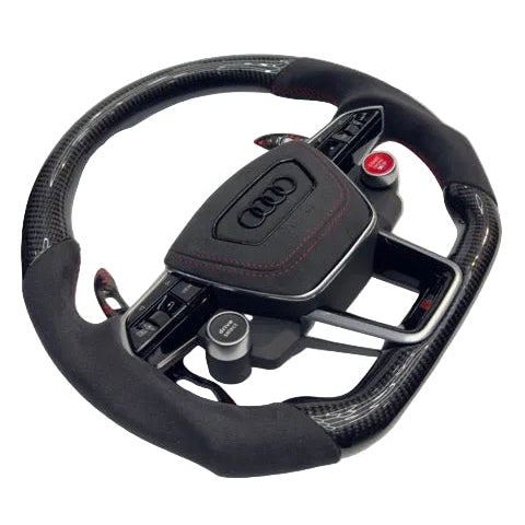 Carbon fiber steering wheel with Audi logo on a white background